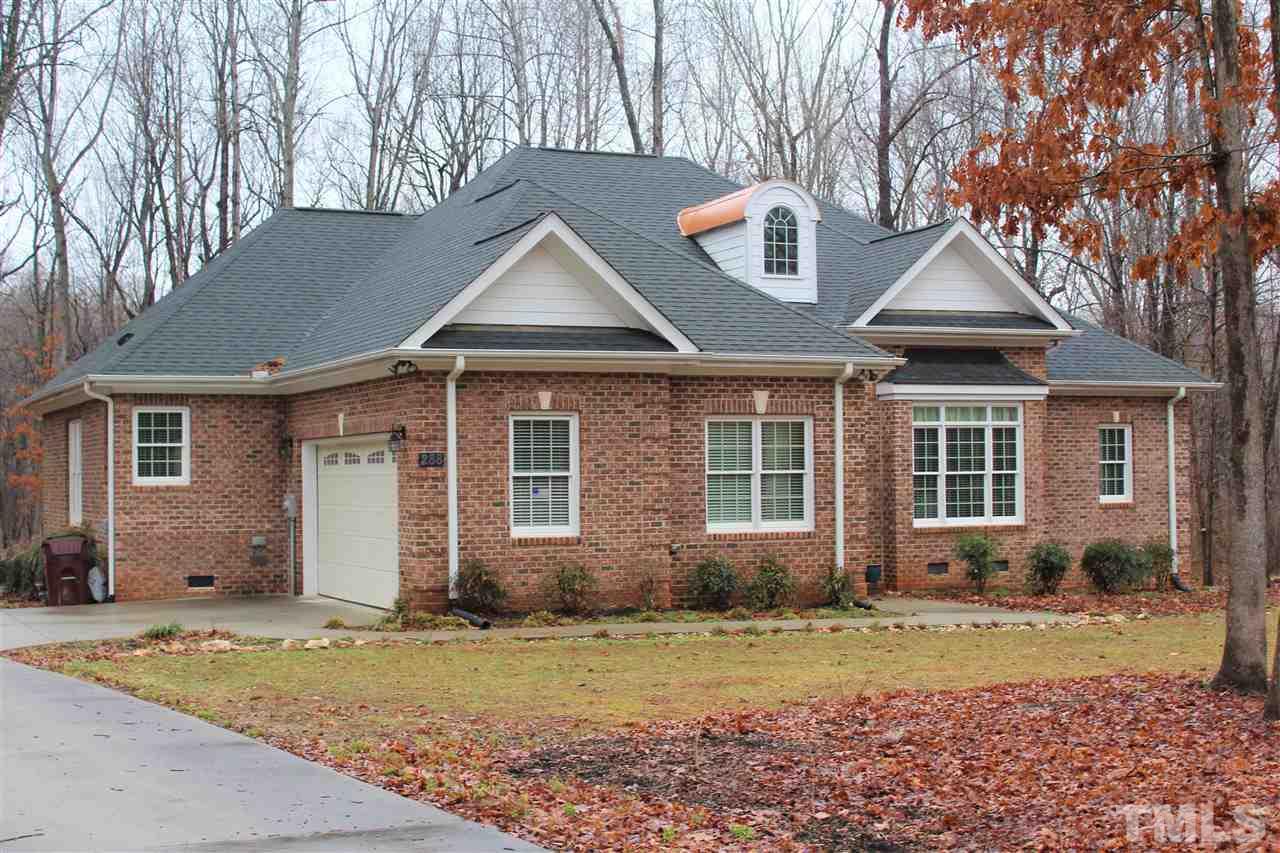 288 North Old Lantern Road Timberlake, NC 27583 - Photo 1 of 20 a front view of a house with a yard