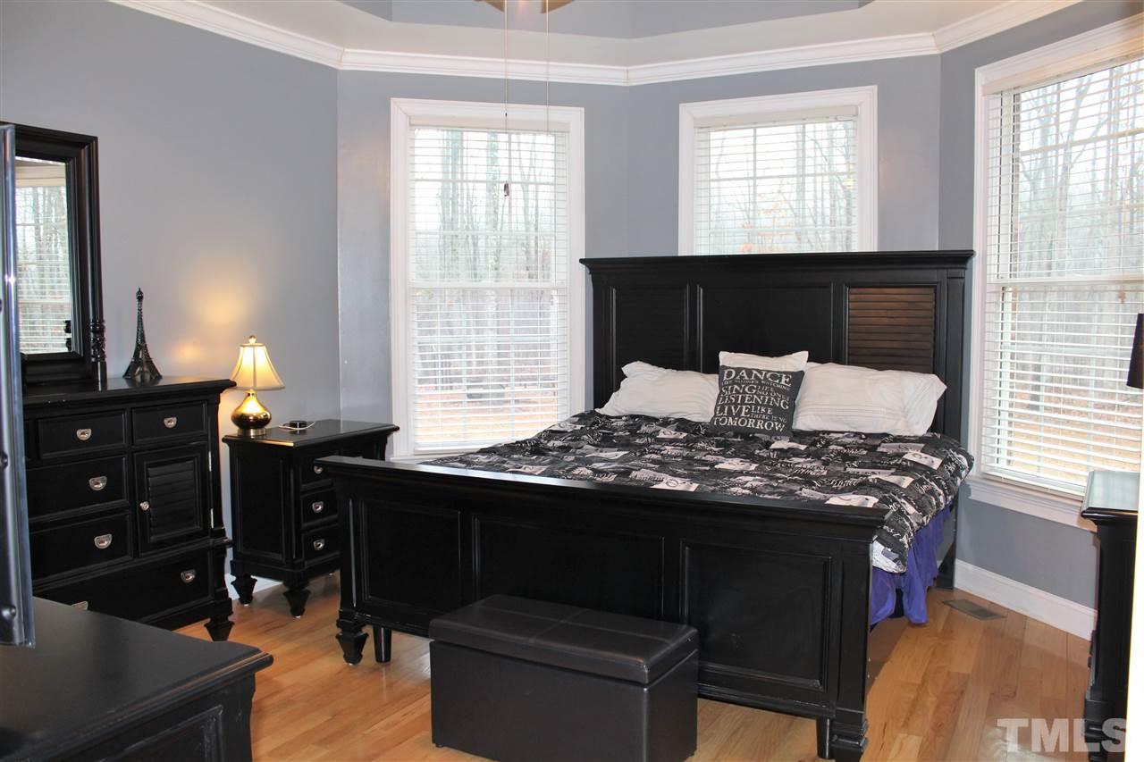 288 North Old Lantern Road Timberlake, NC 27583 - Photo 14 of 20 a bedroom with a bed and a dresser