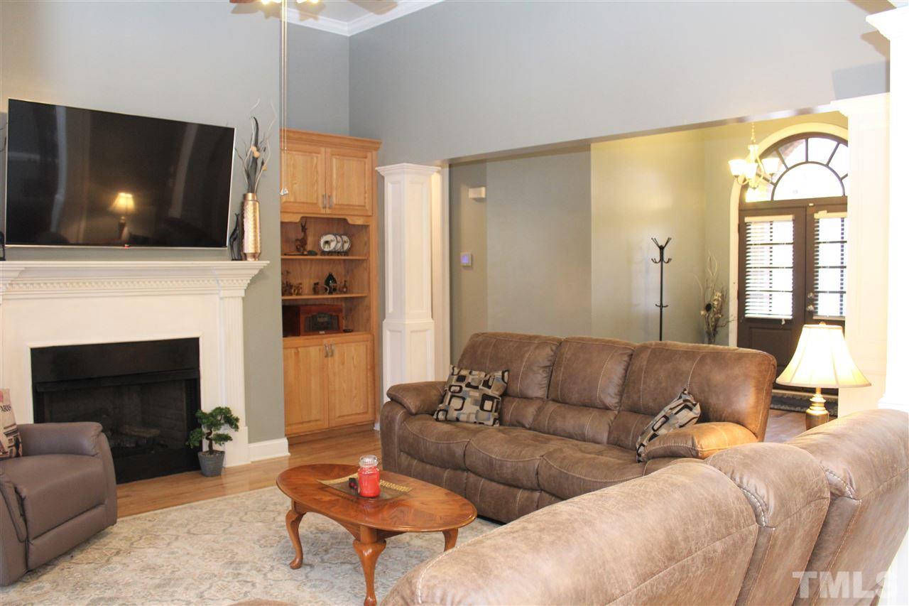 288 North Old Lantern Road Timberlake, NC 27583 - Photo 4 of 20 a living room with furniture and a flat screen tv