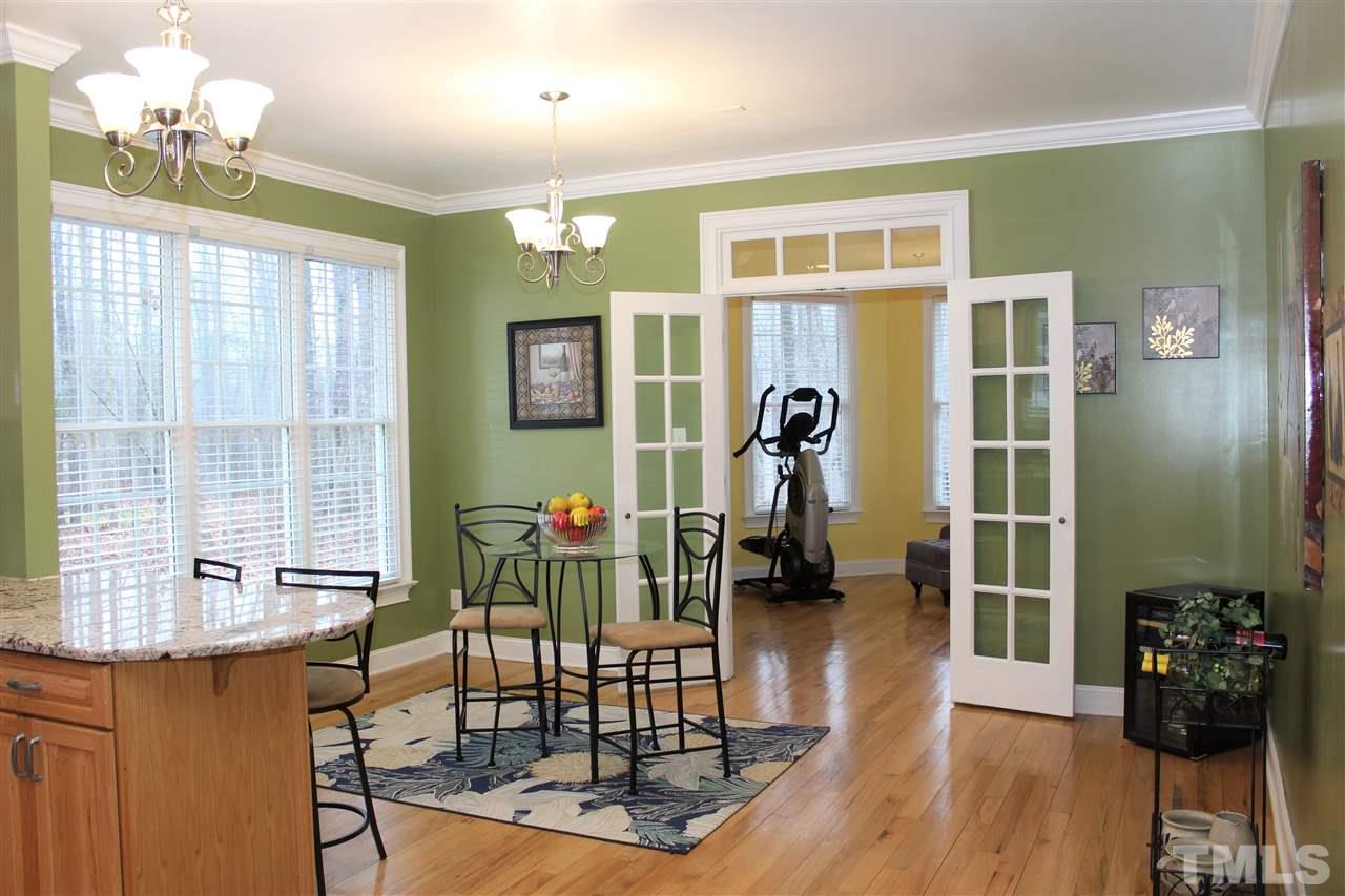 288 North Old Lantern Road Timberlake, NC 27583 - Photo 8 of 20 a view of a dining room with furniture and wooden floor