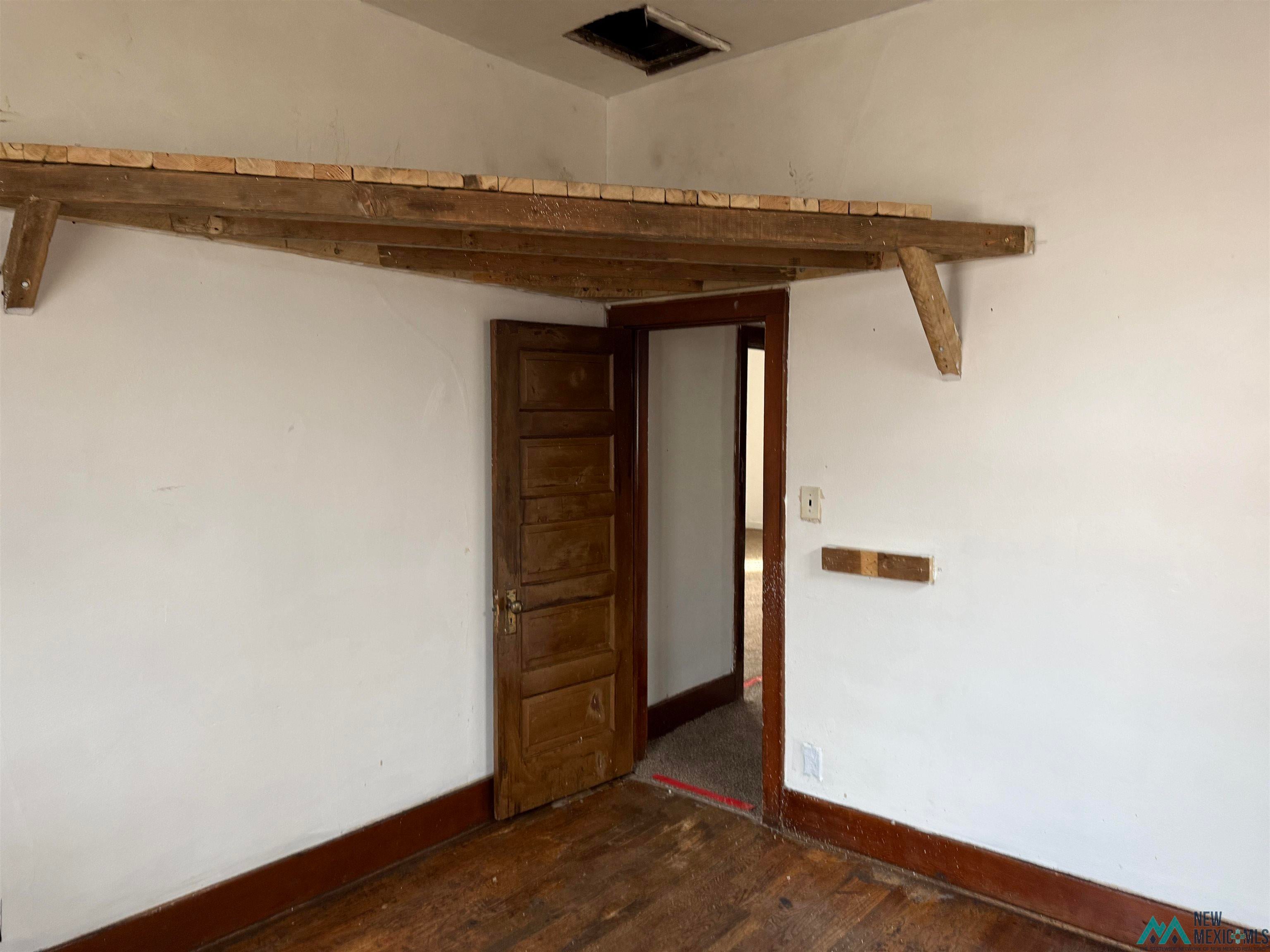 524 South 1st Street Raton, NM 87740 - Photo 15 of 21 Unfurnished room featuring dark wood finished floors and baseboards
