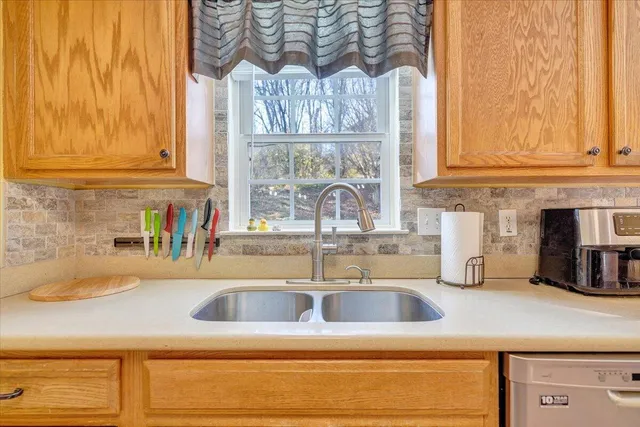 a kitchen with a sink and a window