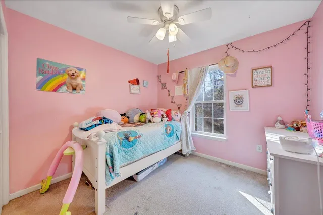 a bedroom with furniture and a wooden floor