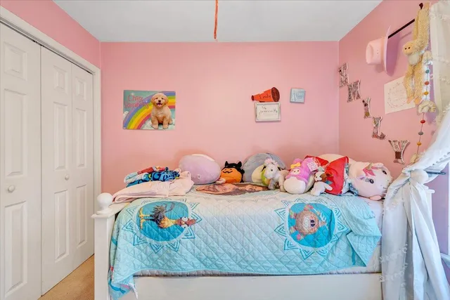 a bedroom with toys and a bed