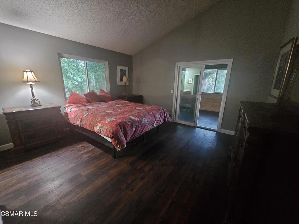 4997 Shadow Canyon Road Templeton, CA 93465 - Photo 11 of 18 a spacious bedroom with a bed and wooden floor