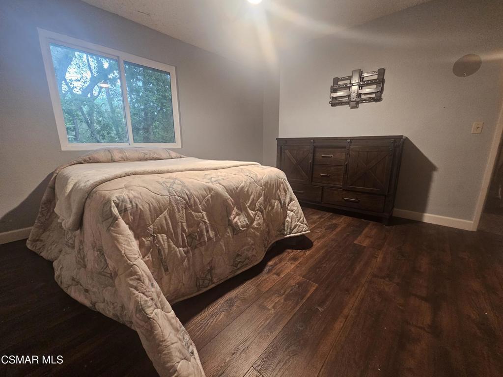 4997 Shadow Canyon Road Templeton, CA 93465 - Photo 14 of 18 a bed sitting in a bedroom next to a window