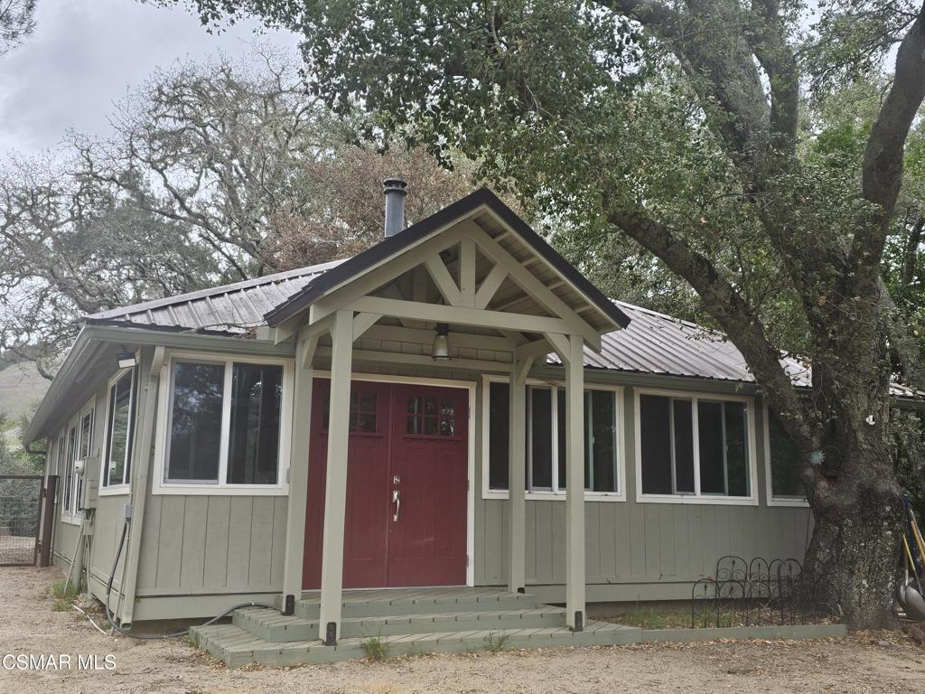 4997 Shadow Canyon Road Templeton, CA 93465 - Photo 3 of 18 a front view of a house with a garden