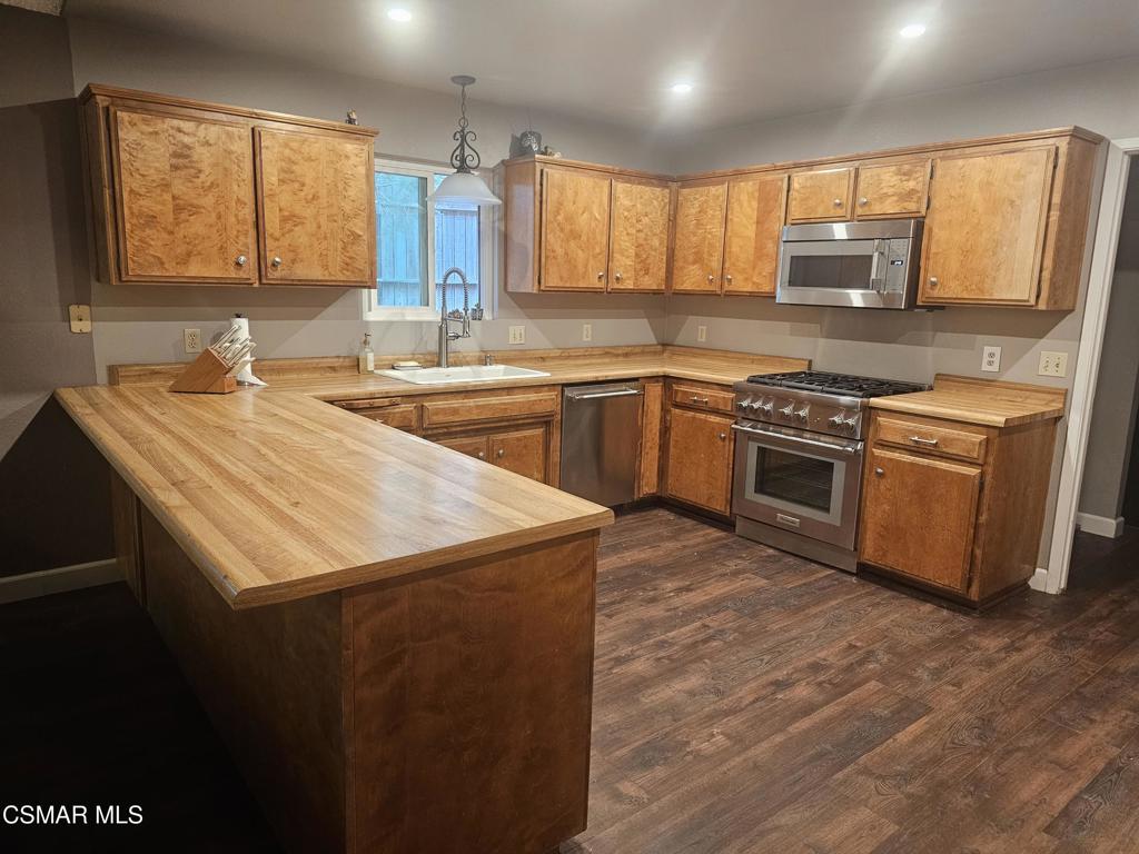 4997 Shadow Canyon Road Templeton, CA 93465 - Photo 8 of 18 a kitchen with stainless steel appliances granite countertop a sink stove window and refrigerator