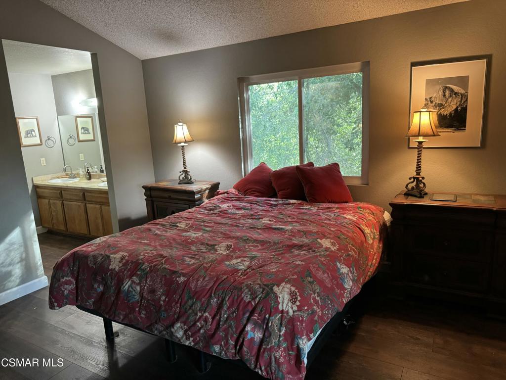 4997 Shadow Canyon Road Templeton, CA 93465 - Photo 10 of 18 a bedroom with a bed and wooden floor
