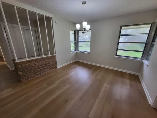 a kitchen with granite countertop cabinets and steel stainless steel appliances
