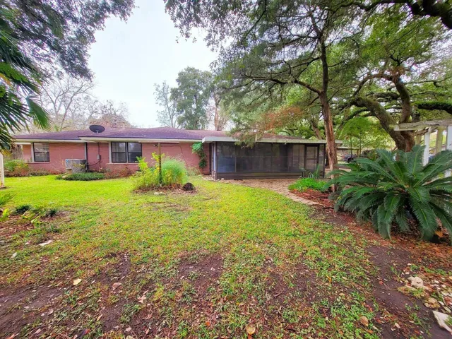 a view of a house with a yard porch and sitting area