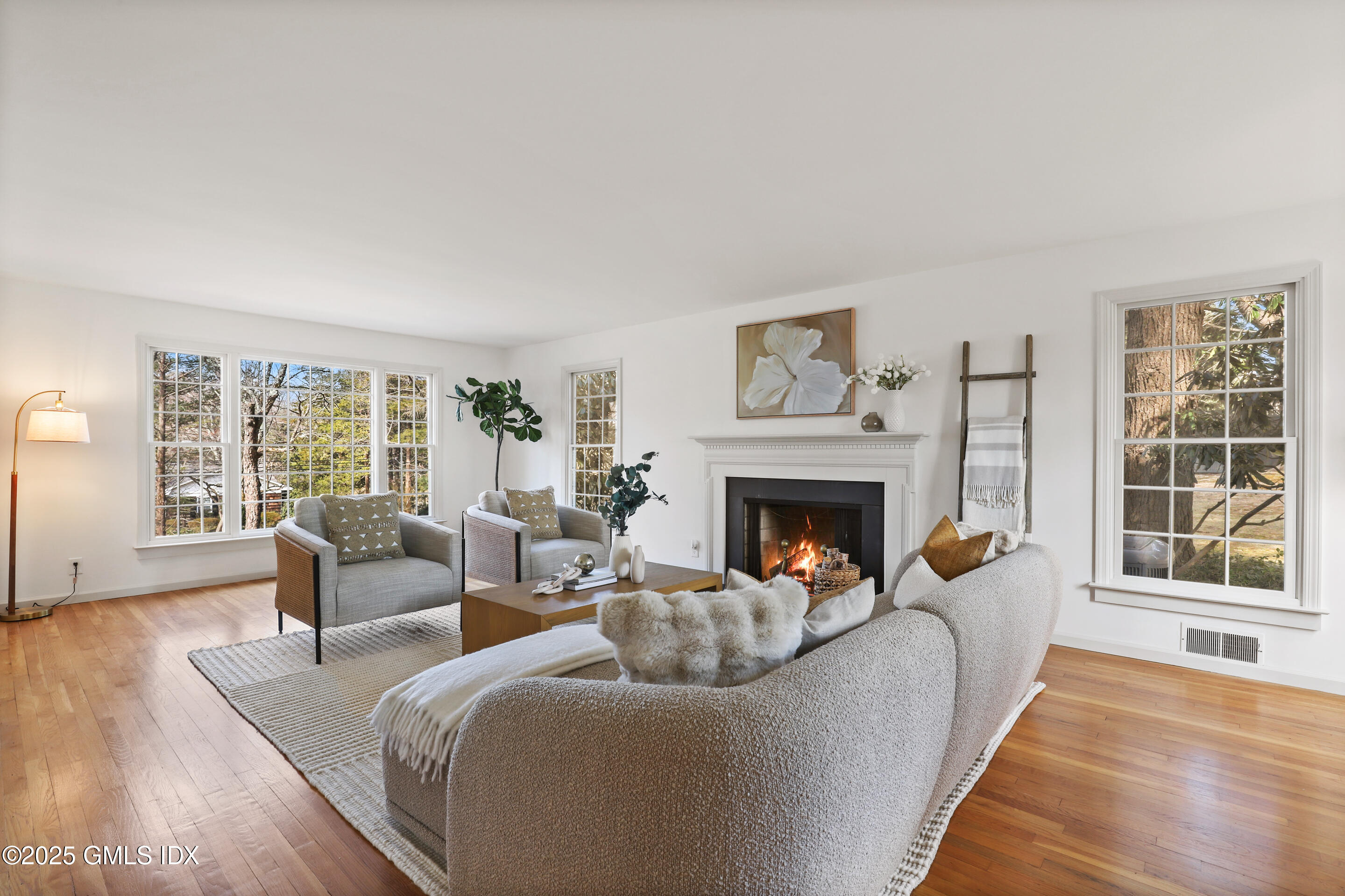 181 Stanwich Road Greenwich, CT 06830 - Photo 5 of 36 a living room with fireplace furniture and a large window