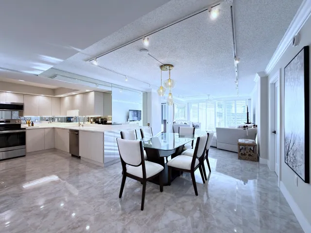 a dining room with furniture and a chandelier