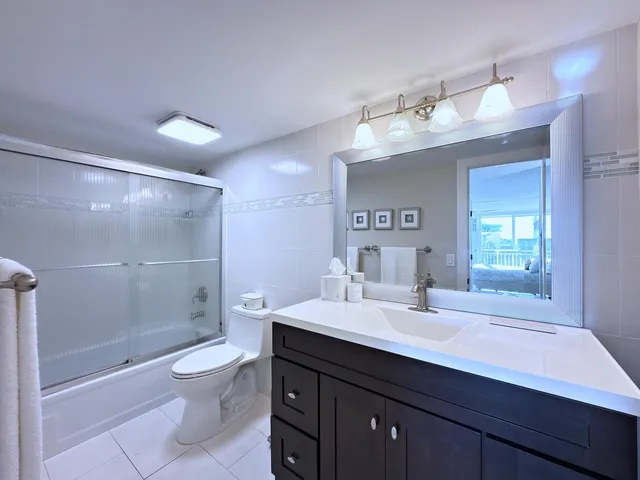 a bedroom with a bed and a lamp