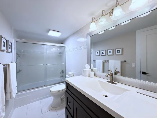 a bedroom with a bed and a television