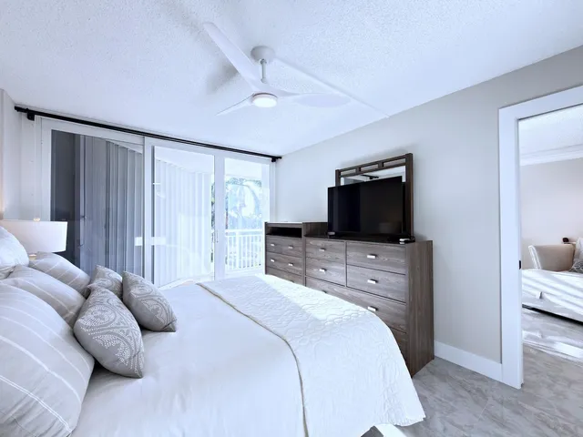 a view of a swimming pool with a patio and a garden