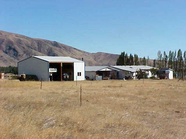 1241 Noye Road Tieton, WA 98947 - Photo 1 of 7 a front view of a house with a yard and garage