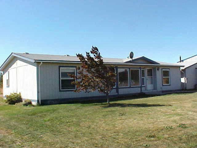 1241 Noye Road Tieton, WA 98947 - Photo 4 of 7 a front view of a house with a garden