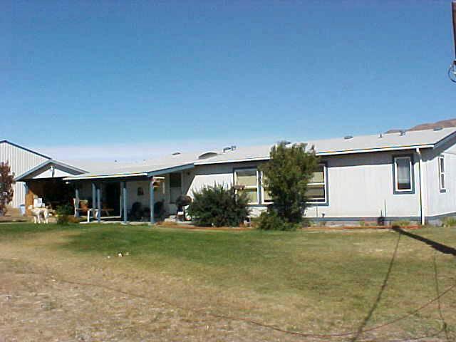1241 Noye Road Tieton, WA 98947 - Photo 6 of 7 a view of a house with yard and garage