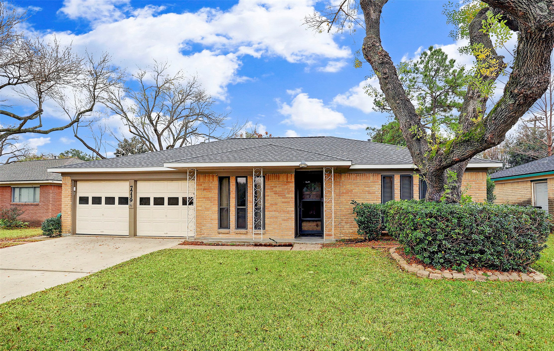 7739 Kensico Road Houston, TX 77036 - Photo 1 of 21 front view of a house with a yard