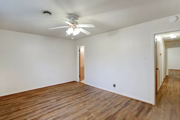 a view of an empty room with windows