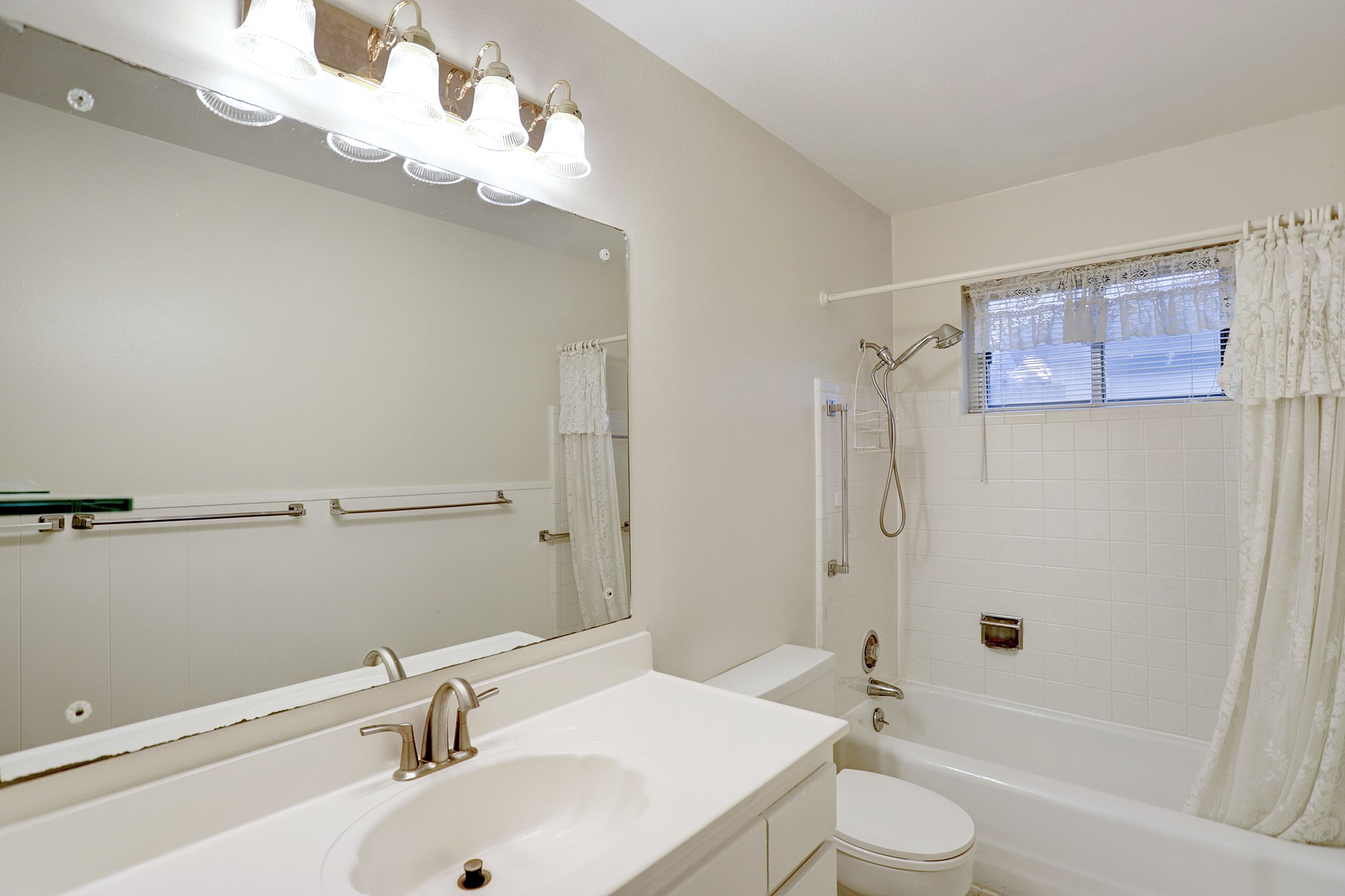 7739 Kensico Road Houston, TX 77036 - Photo 15 of 21 a bathroom with a sink a toilet and shower