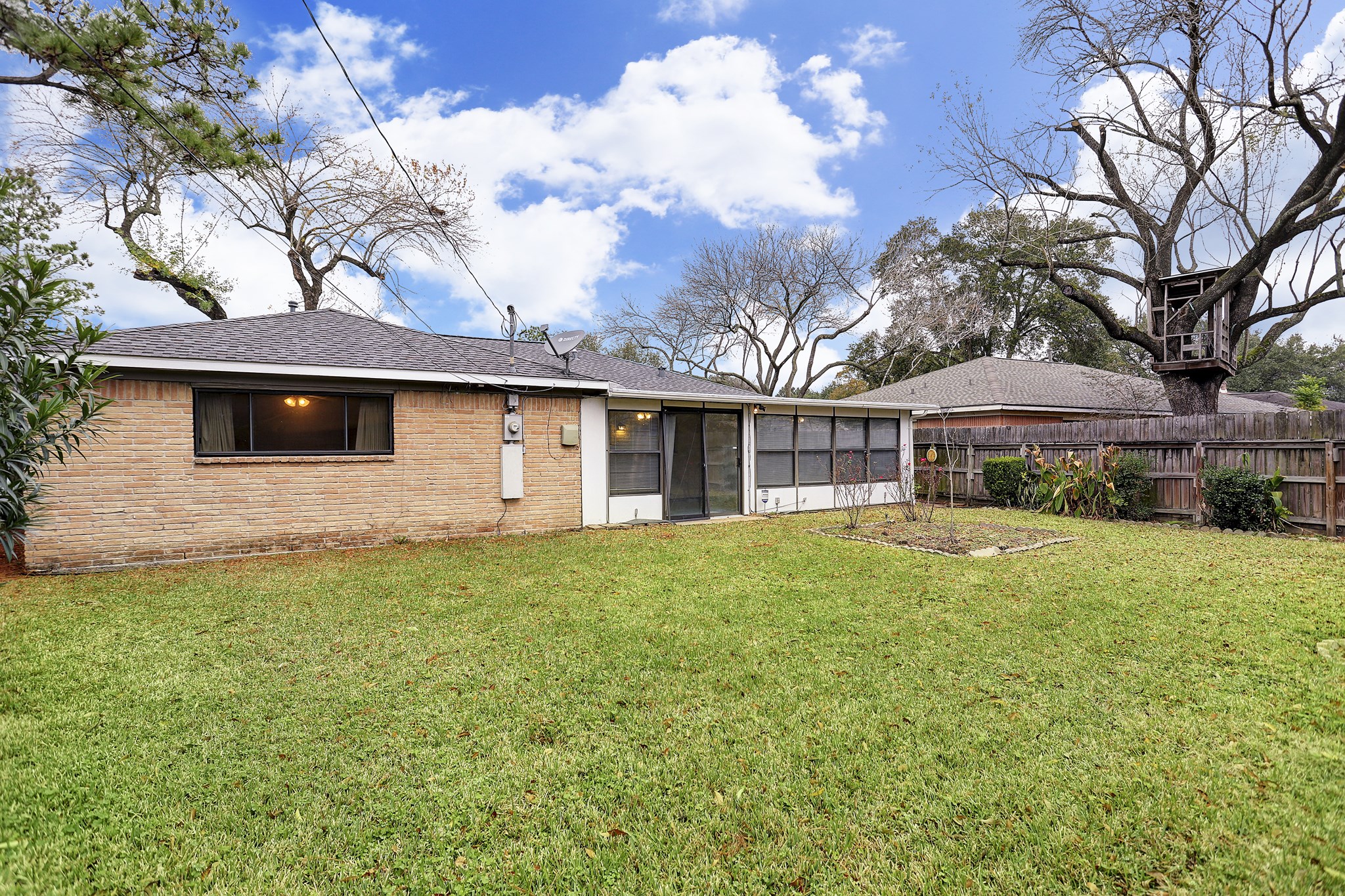 7739 Kensico Road Houston, TX 77036 - Photo 16 of 21 a view of a yard in front of a house