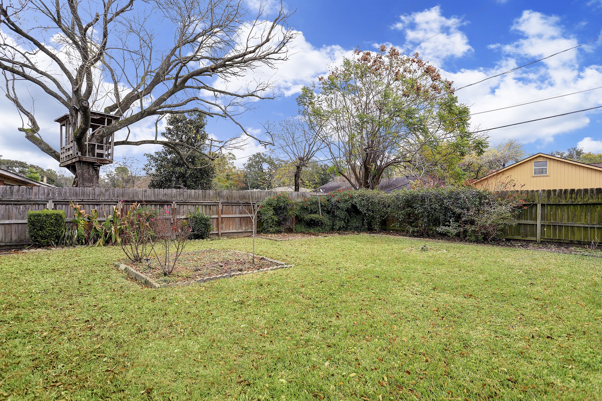 7739 Kensico Road Houston, TX 77036 - Photo 18 of 21 a view of backyard with table and chairs under an umbrella