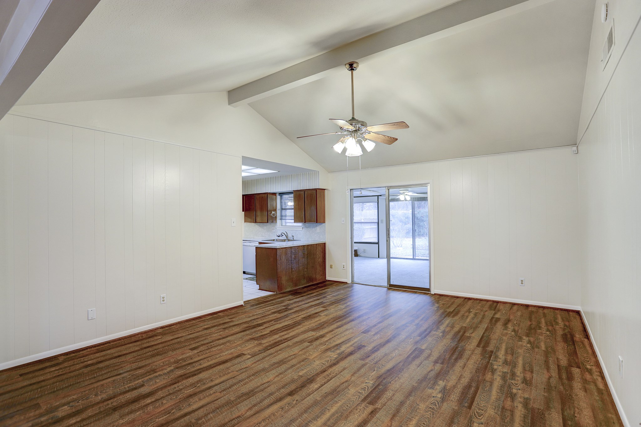 7739 Kensico Road Houston, TX 77036 - Photo 21 of 21 a view of empty room with wooden floor and window