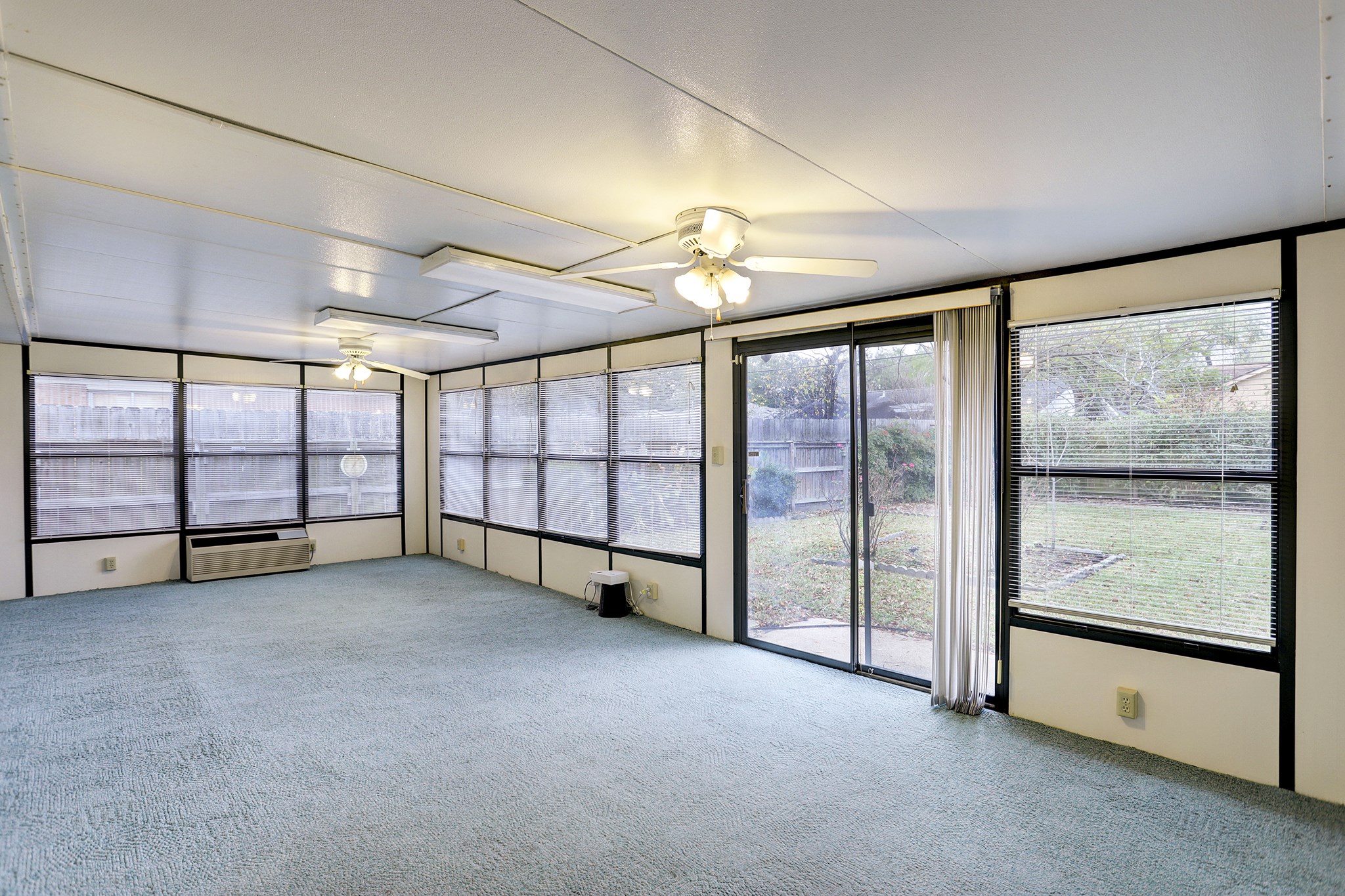 7739 Kensico Road Houston, TX 77036 - Photo 8 of 21 a view of an empty room with windows