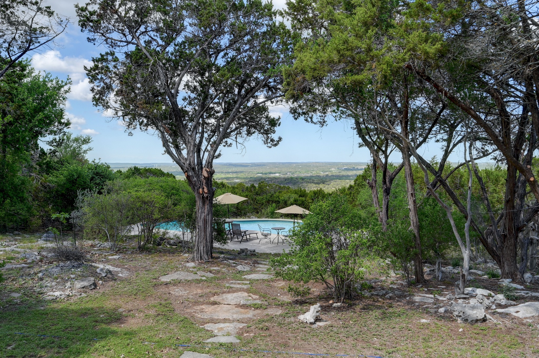 900 Box Canyon Road Wimberley, TX 78676 - Photo 37 of 40 The land gently slopes down to the pool area.