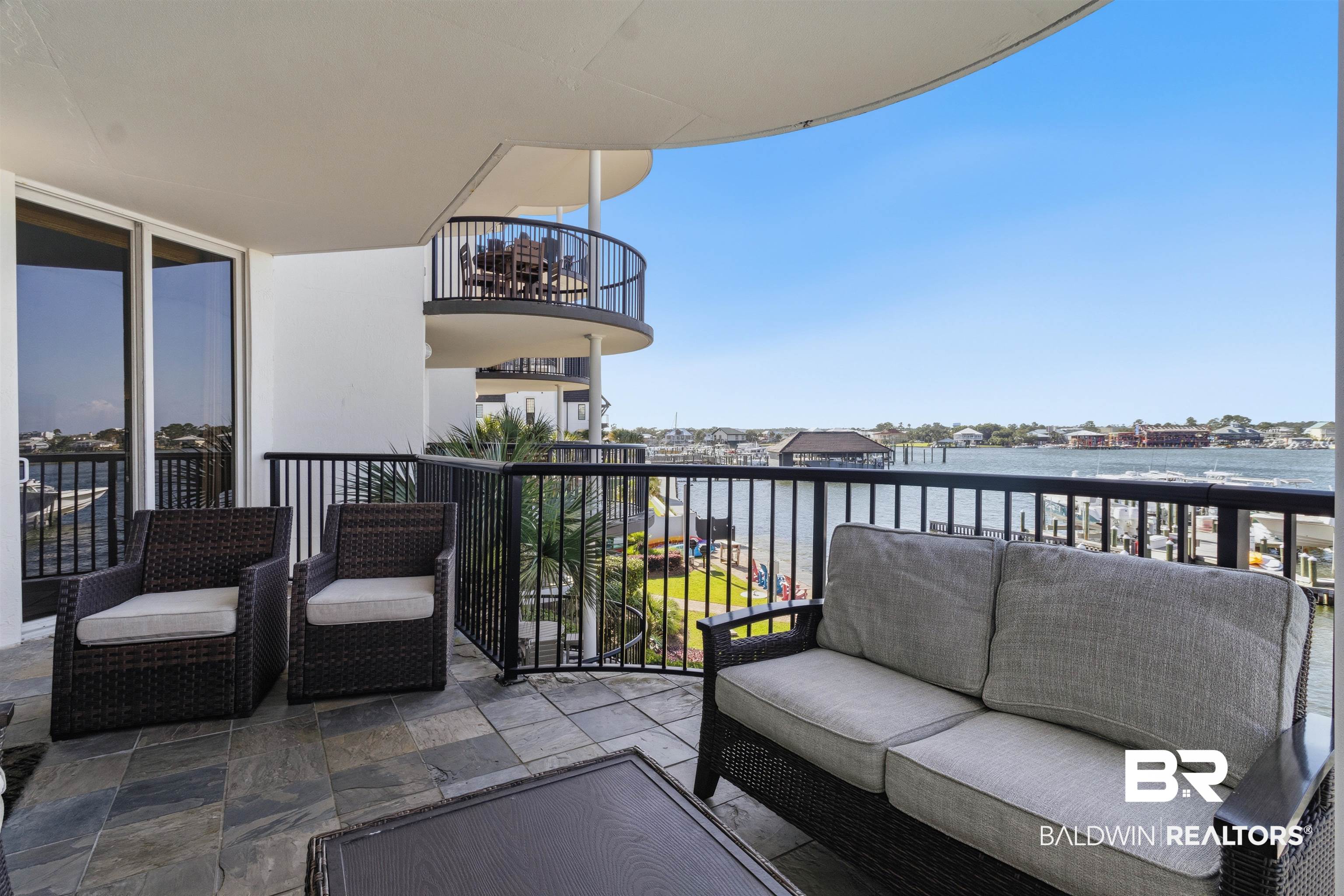 3564 Bayou Road, Unit 203 Orange Beach, AL 36561 - Photo 13 of 53 Expansive private balcony featuring slate tile flooring and black metal railings