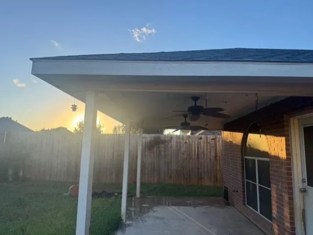a view of empty room with wooden floor and cabinet