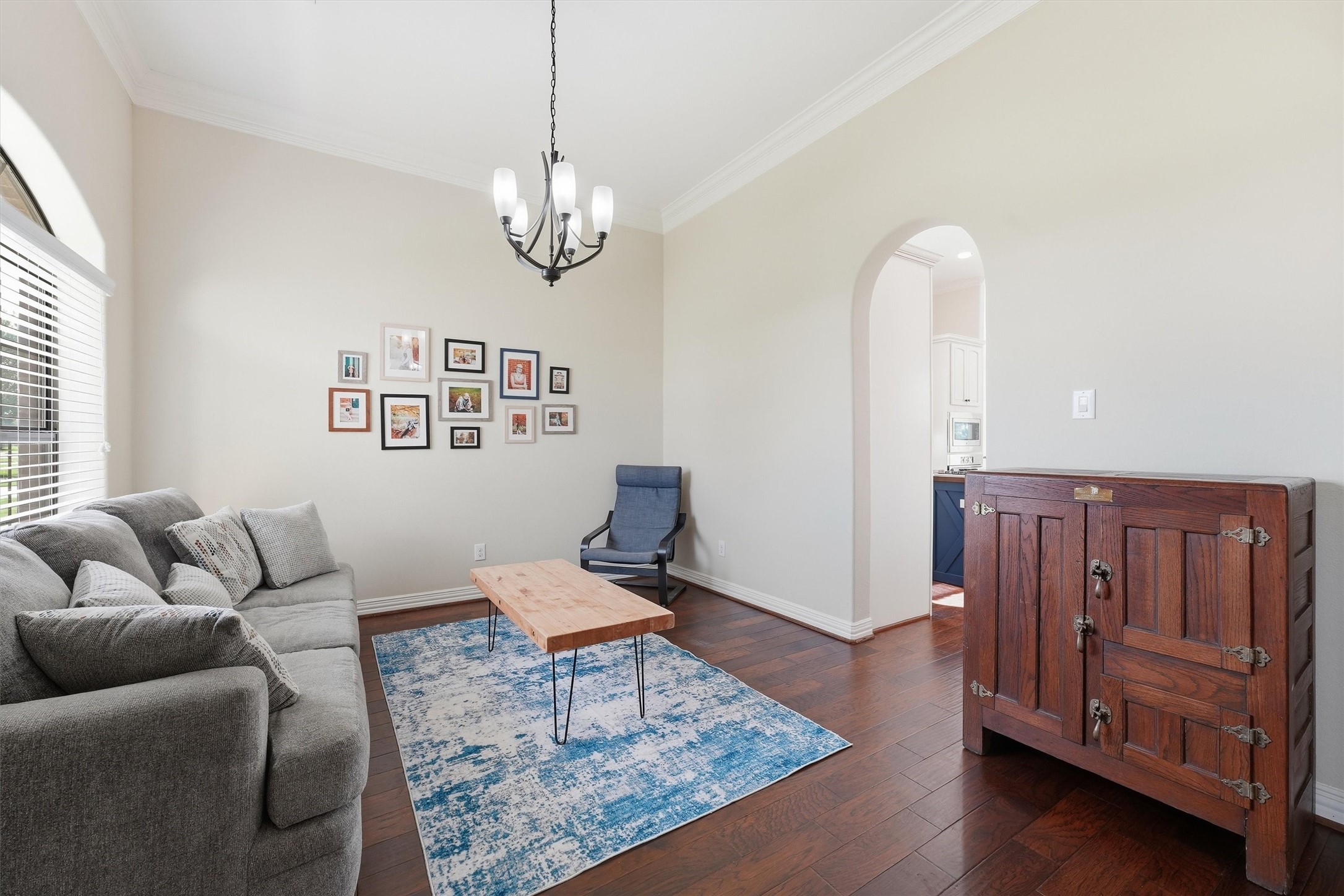 4810 Magnolia Bend Drive Rosharon, TX 77583 - Photo 6 of 40 Formal dining or extra living area features wood flooring and arched doorway leading to the kitchen.