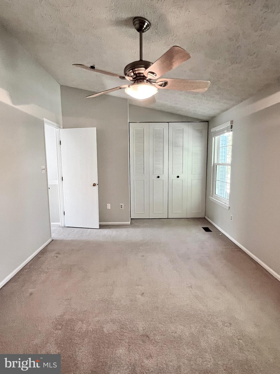 9624 Glendower Court Laurel, MD 20723 - Photo 18 of 26 a view of an empty room with a chandelier fan