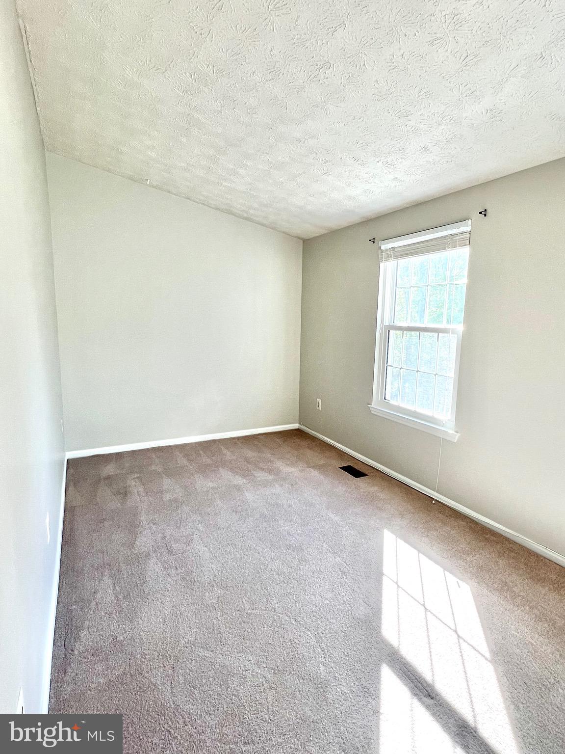 9624 Glendower Court Laurel, MD 20723 - Photo 20 of 26 an empty room with windows