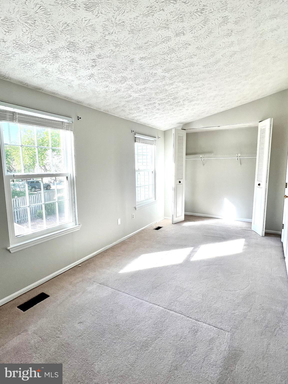 9624 Glendower Court Laurel, MD 20723 - Photo 21 of 26 an empty room with a empty space and windows