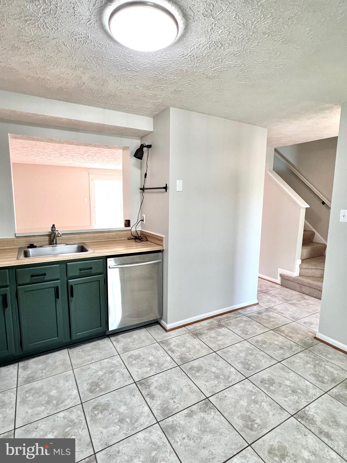 9624 Glendower Court Laurel, MD 20723 - Photo 8 of 26 a kitchen with a cabinets and a stove top oven