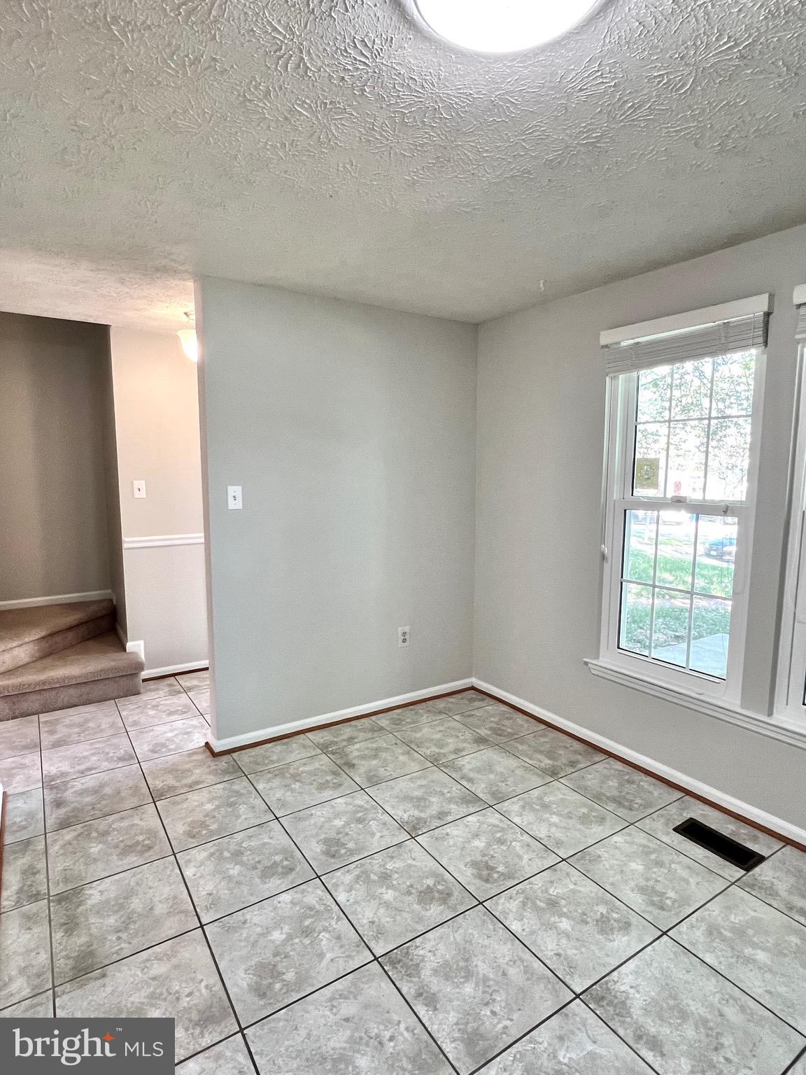 9624 Glendower Court Laurel, MD 20723 - Photo 9 of 26 an empty room with windows