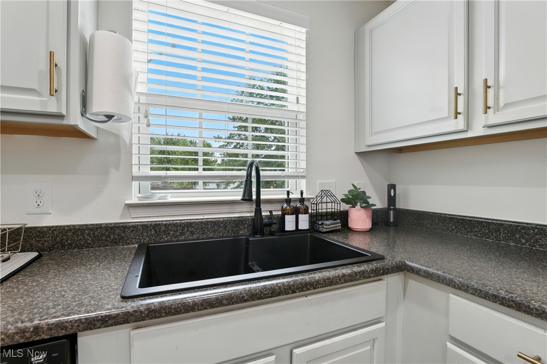 2112 Fowl Road Elyria, OH 44035 - Photo 16 of 49 Kitchen featuring white cabinetry and dark countertops