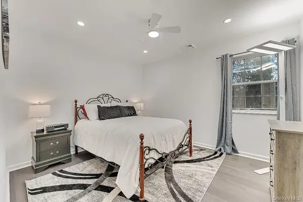 a living room with furniture and a piano