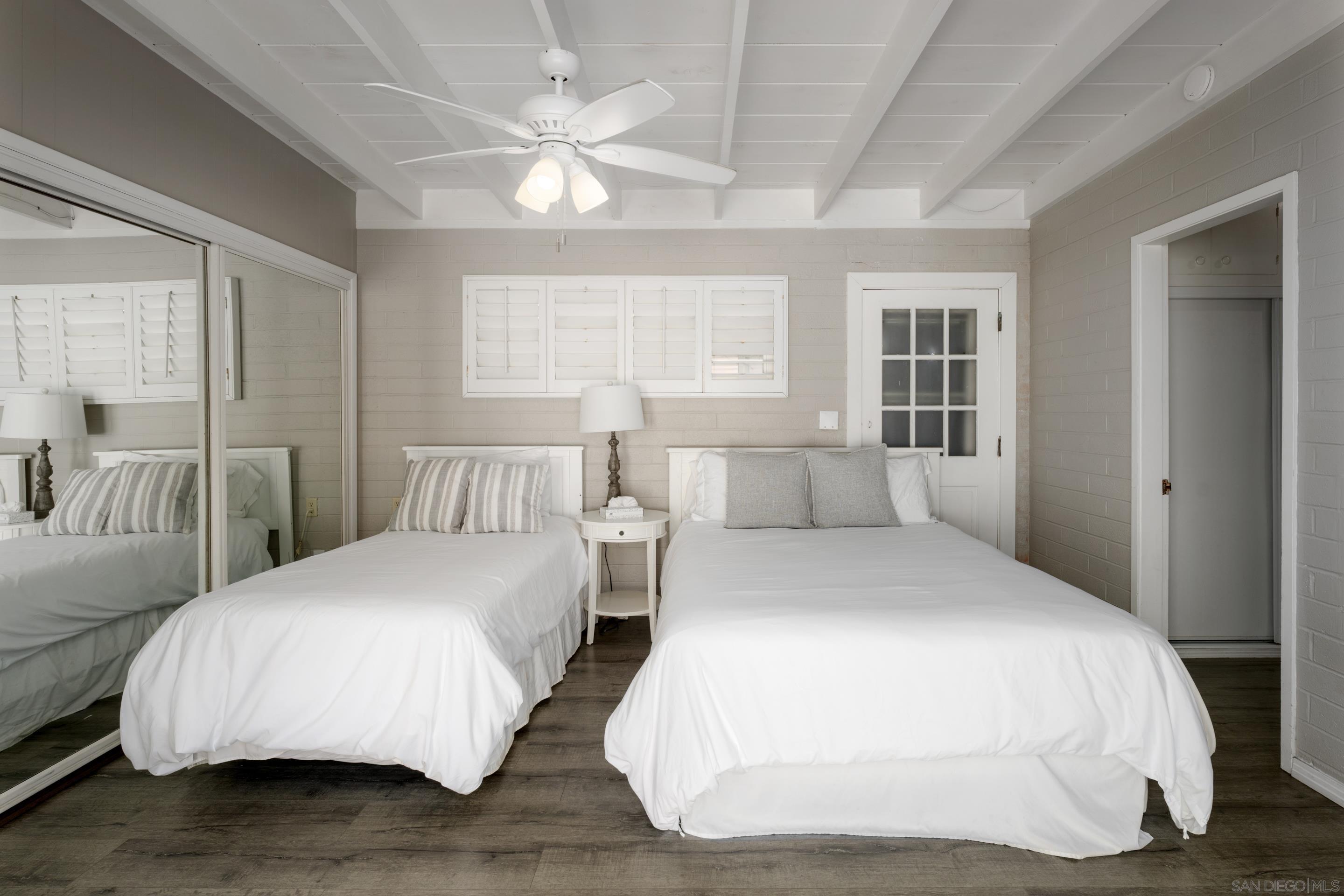 1834 Ocean Front Del Mar, CA 92014 - Photo 15 of 36 a bedroom with double bed and a large window