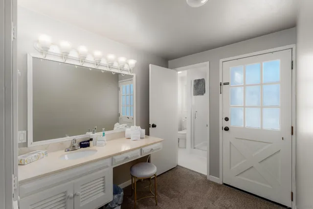 a bathroom with a double vanity sink and mirror