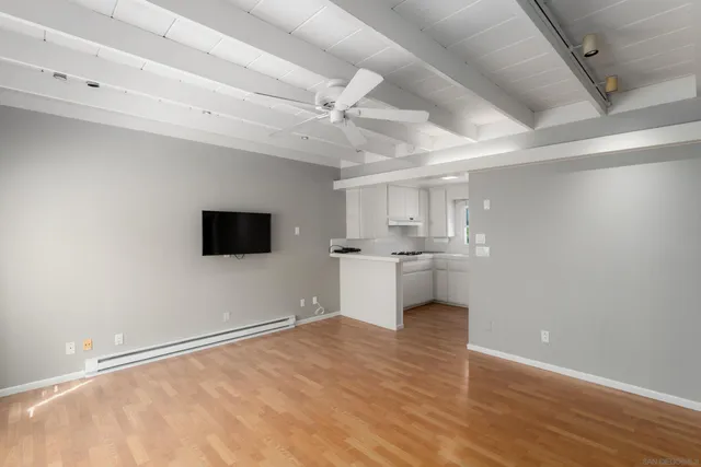 a view of a kitchen with a sink and a microwave