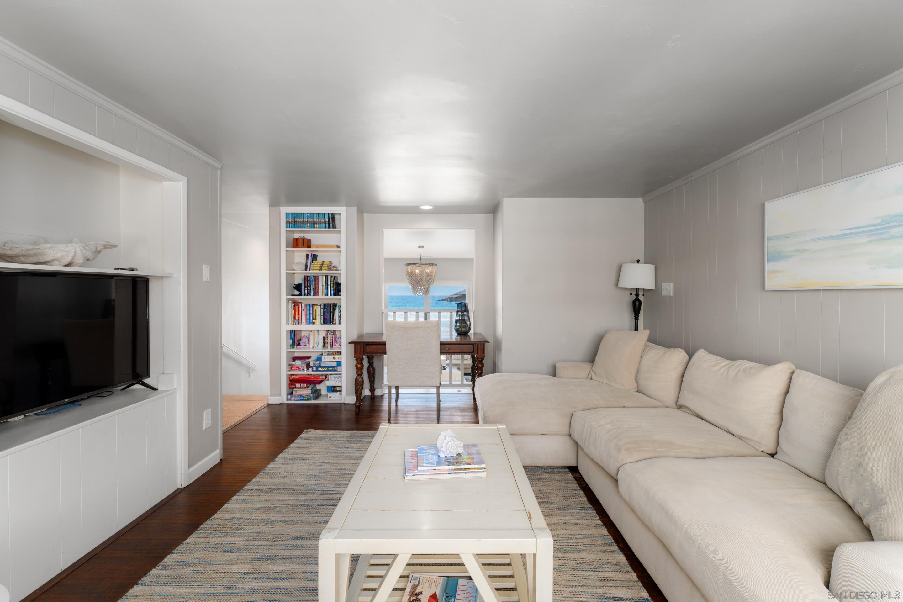 1834 Ocean Front Del Mar, CA 92014 - Photo 9 of 36 a living room with furniture and a flat screen tv