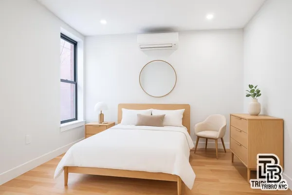 a bedroom with a bed and window