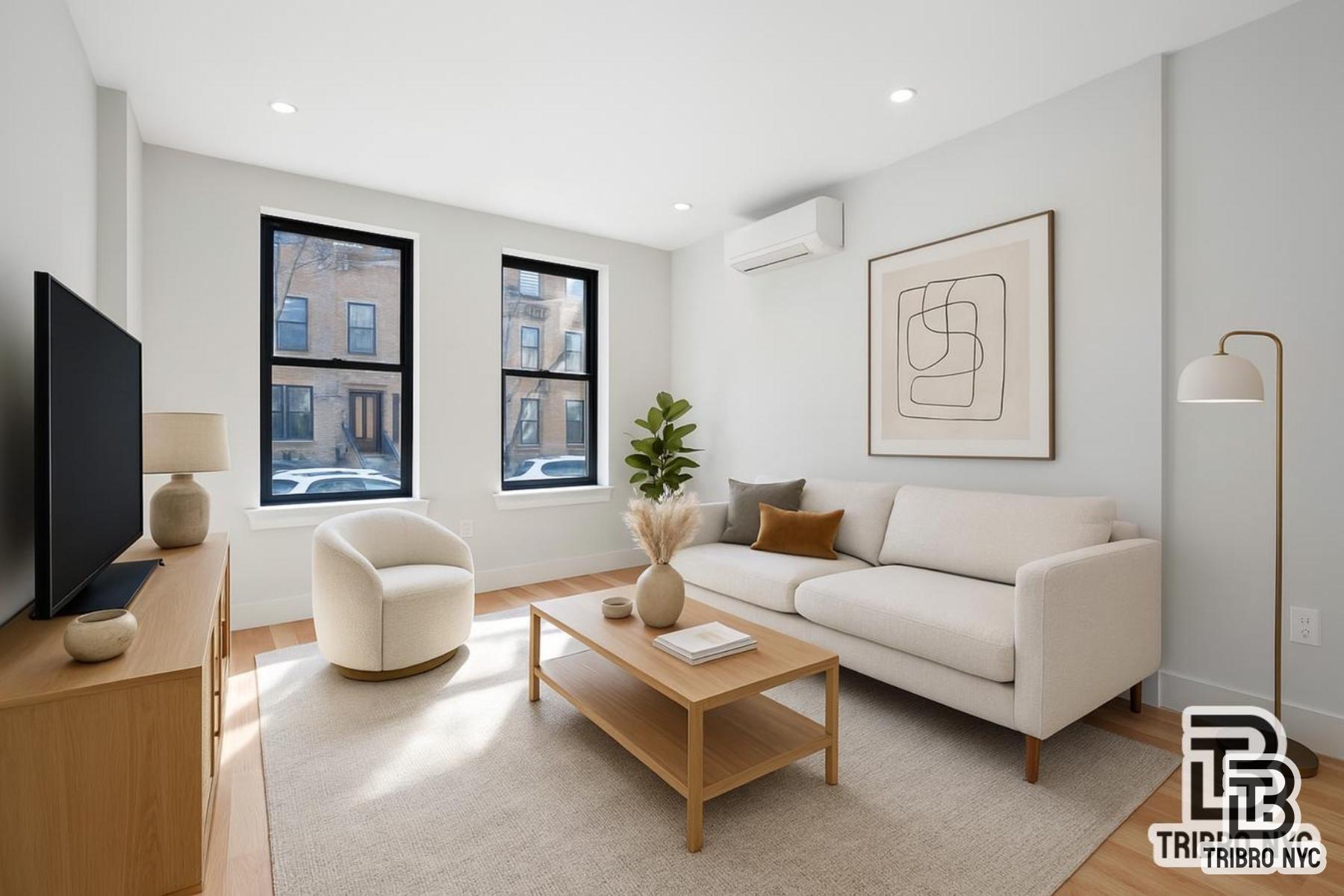 1731 Norman Street, Unit 1R Queens, NY 11385 - Photo 5 of 10 a living room with furniture and a flat screen tv