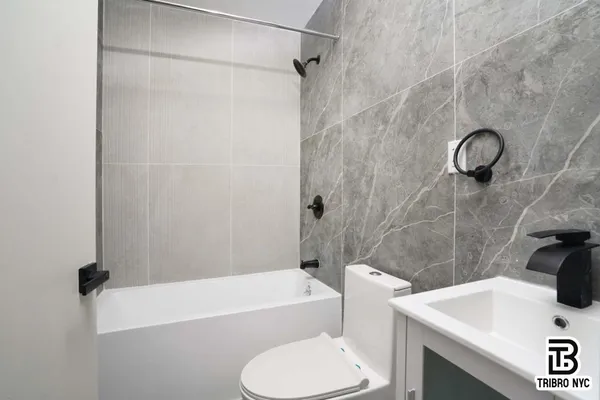 a bathroom with a sink a toilet and a bathtub