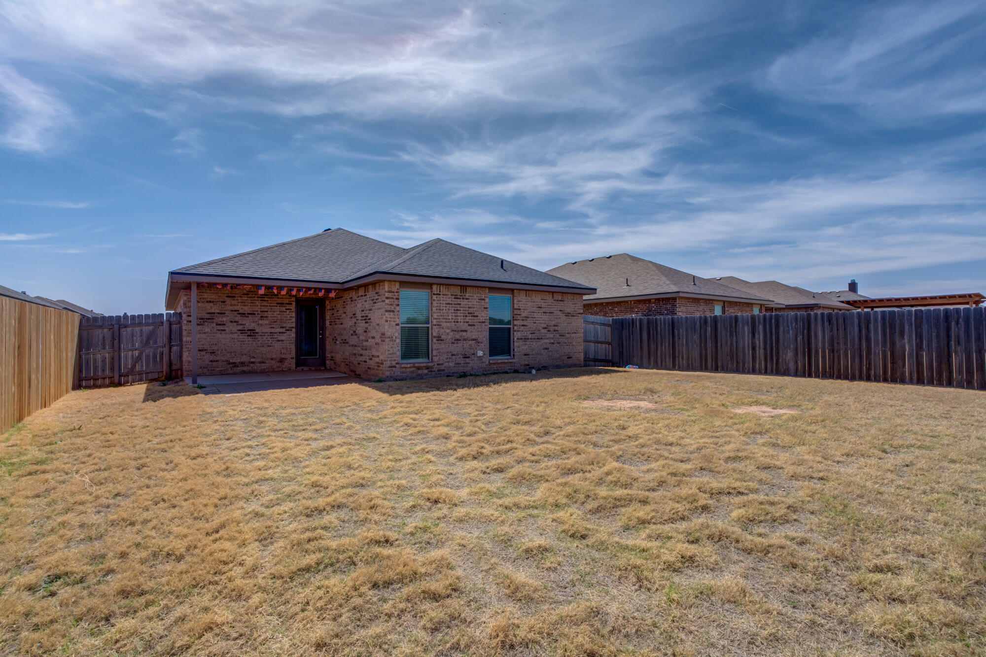 7012 34th Place Lubbock, TX 79407 - Photo 5 of 36 a house view with a garden space