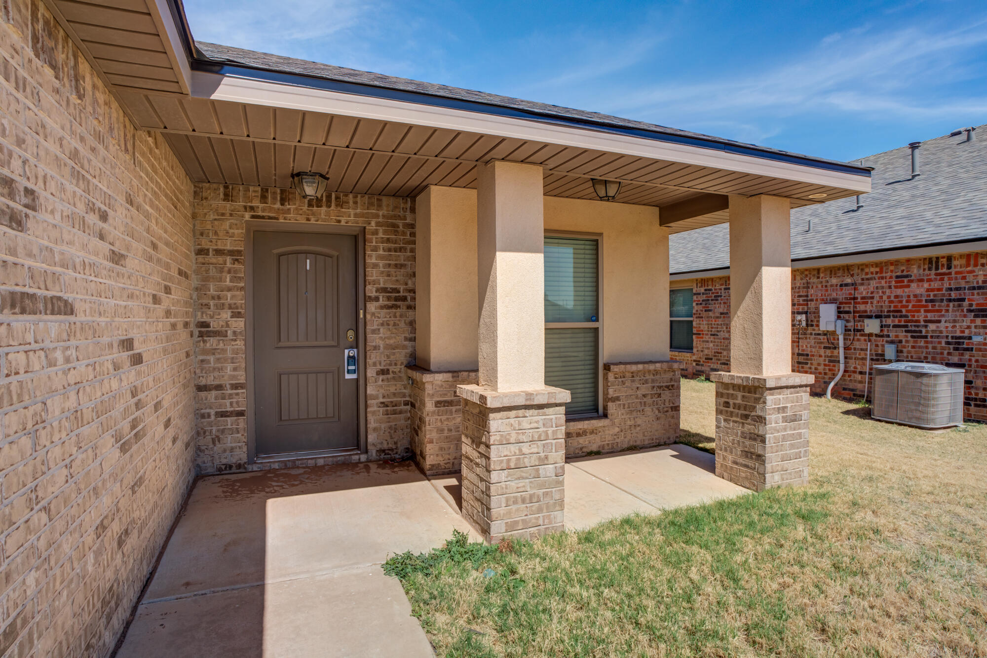 7012 34th Place Lubbock, TX 79407 - Photo 7 of 36 a front view of a house with outdoor seating